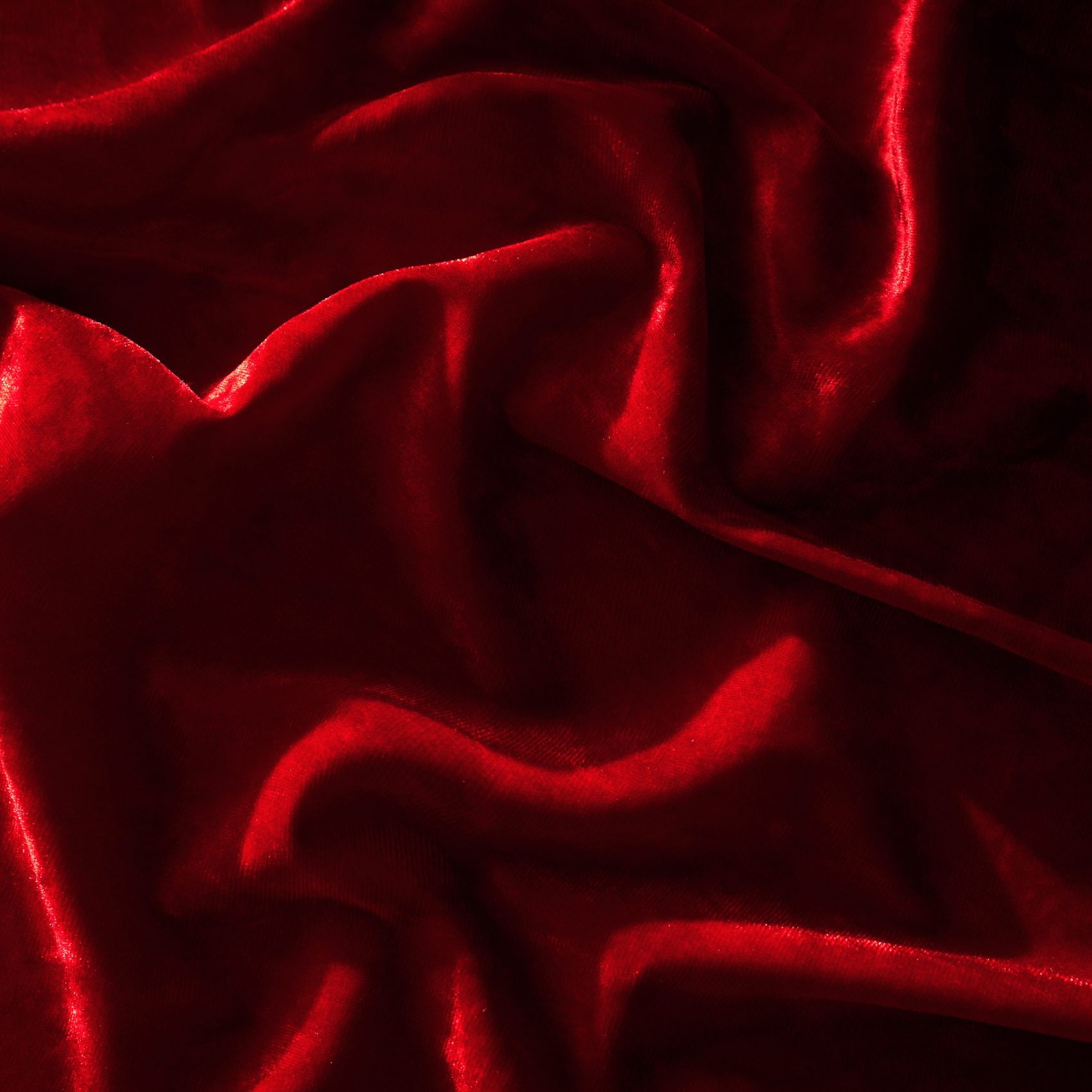 Abstract background made of red velvet fabric. High quality photo